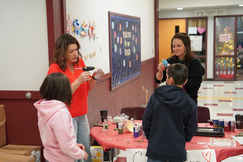 Southwest counselors doing a project with students at Family Art Night