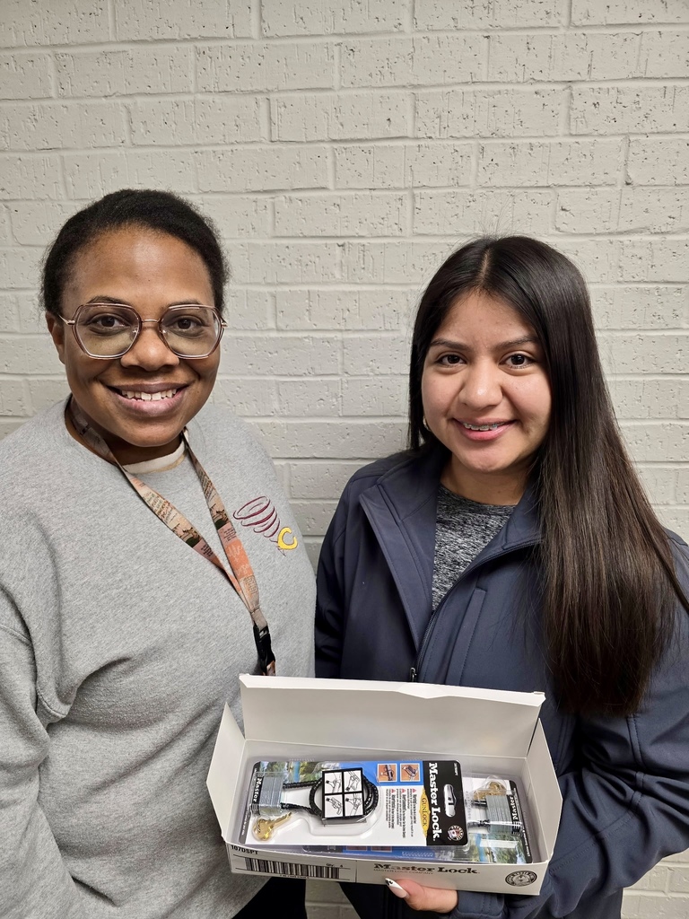 Mrs. Jefferson with the winner of the gun lock.