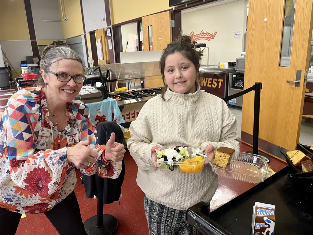 Kitchen Director and student with salad bar