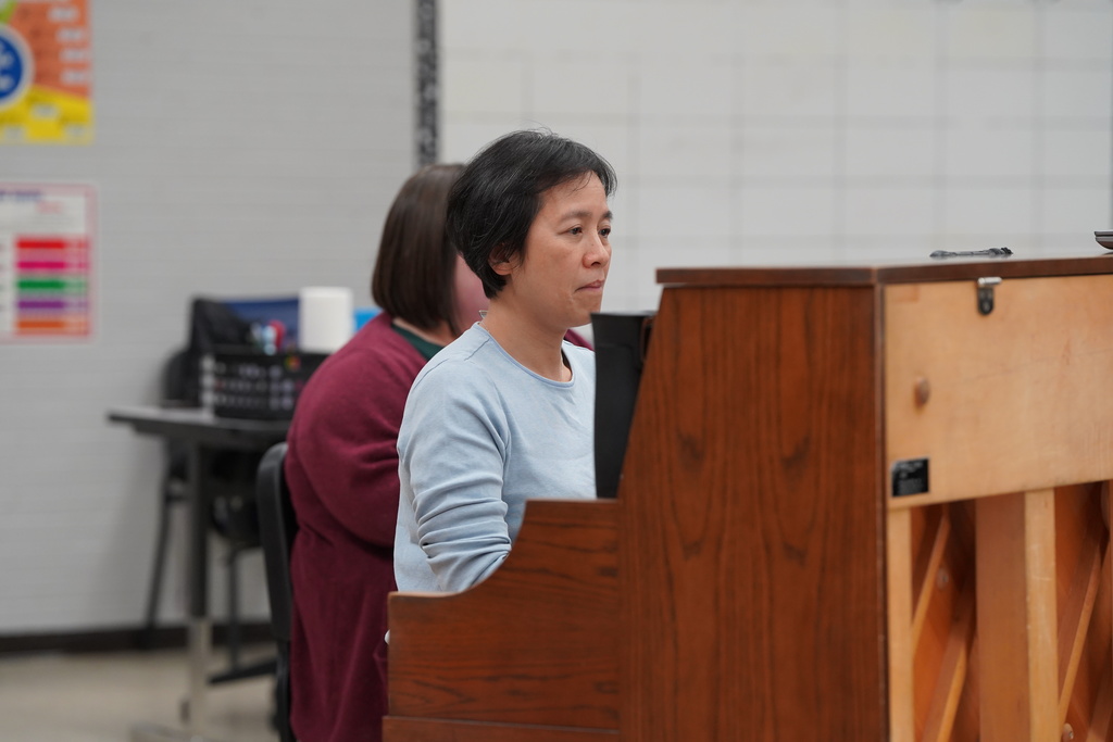 Dr. Lee playing the piano