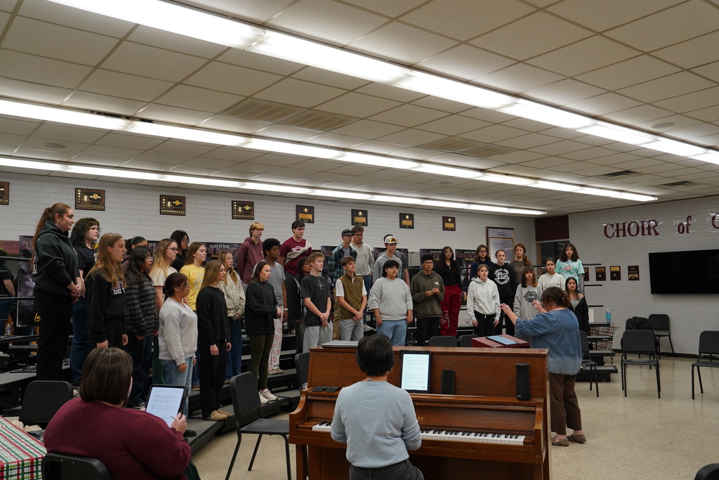 Side view of the choir rehearsing