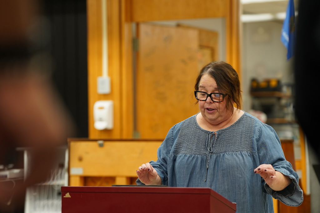 Mrs. Duerksen in front of the choir