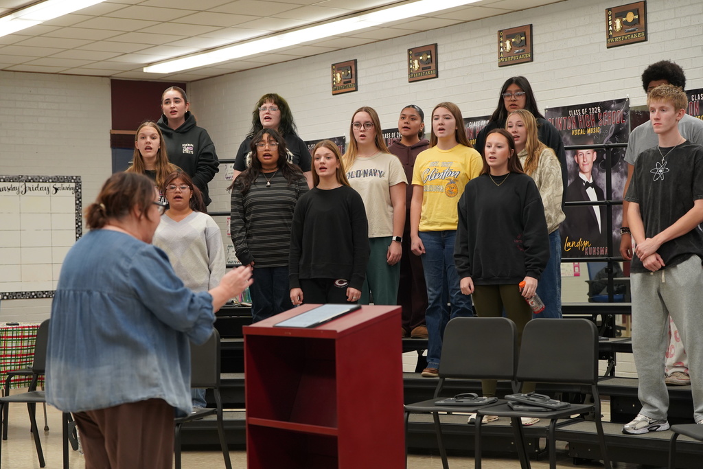 Choir altos rehearsing