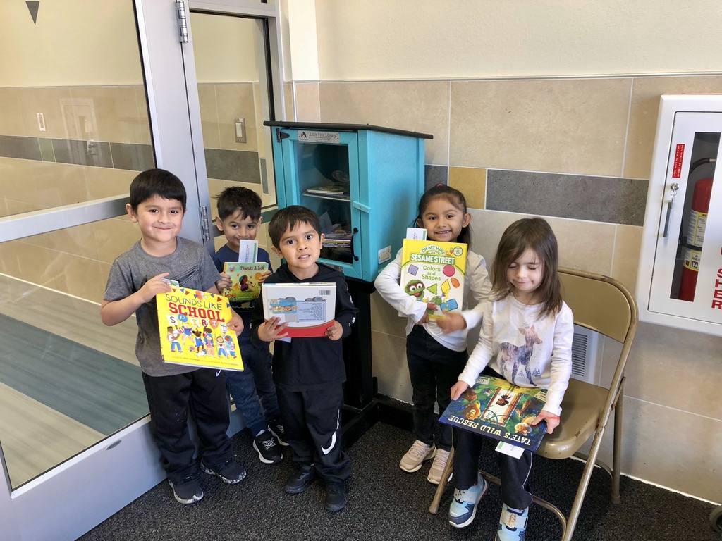 Students getting books from the Little Library at Nance.