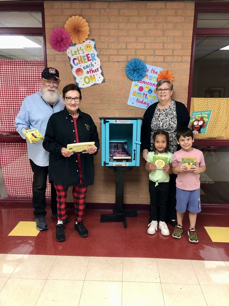 The Perkins with Ms. Miller and students at the Little Library at Nance.