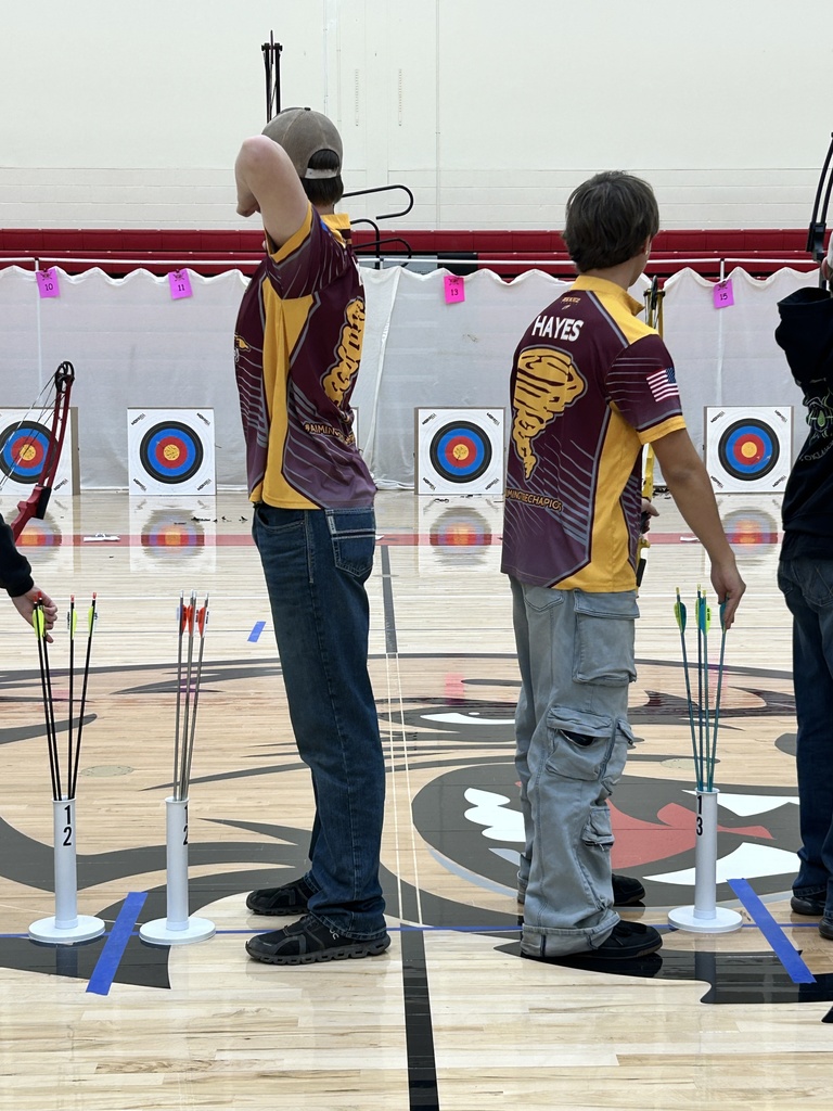 Archery students getting ready to shoot.