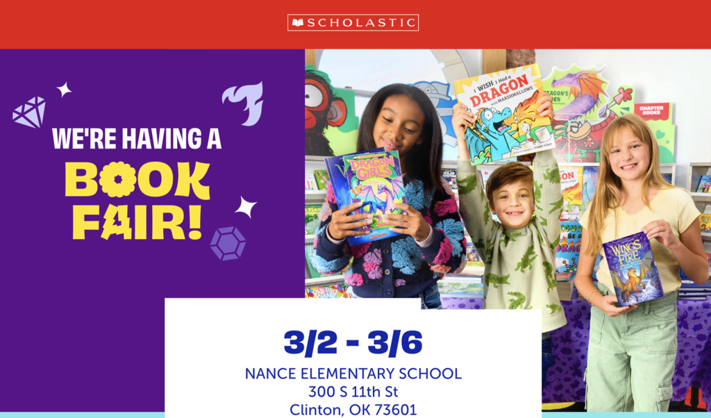 Students holding books at the book fair