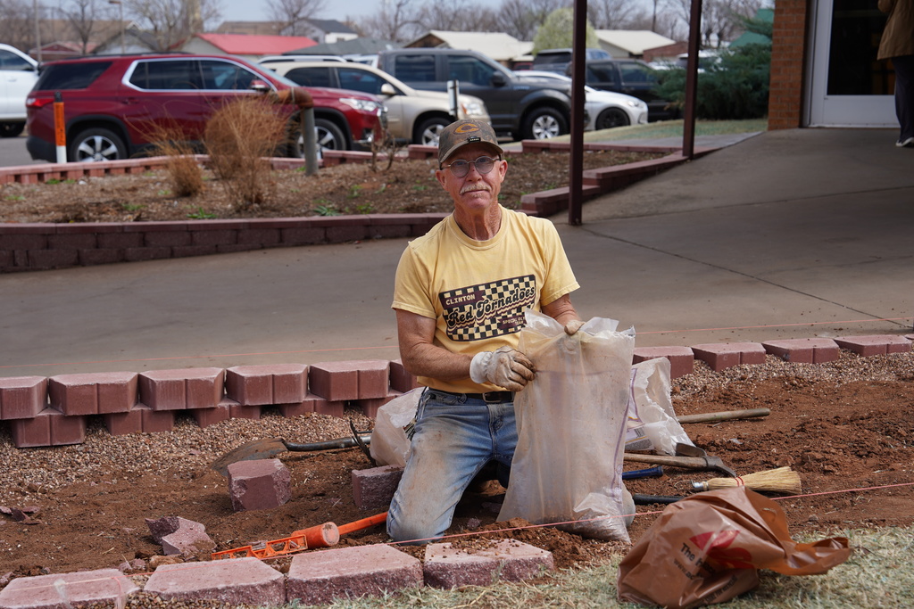 Man working in the flower beds