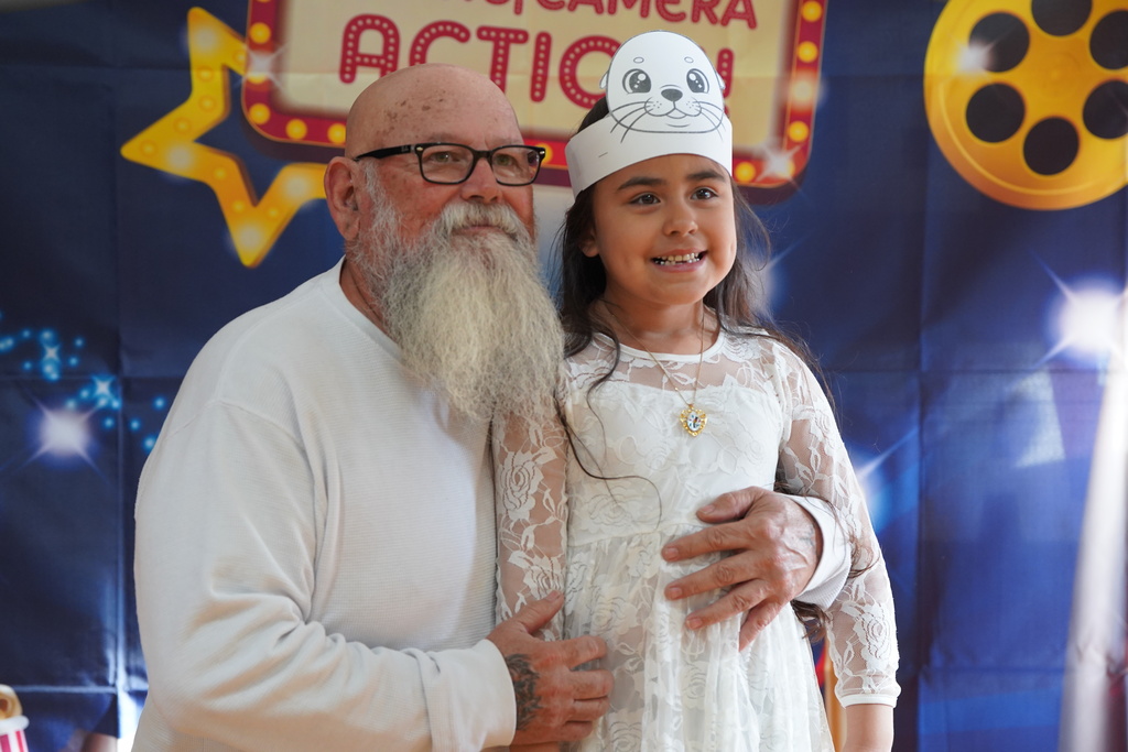 Student and family member posing for picture