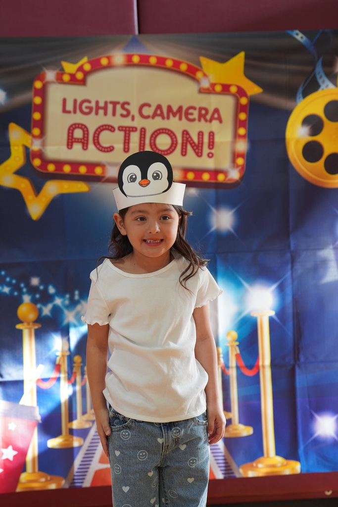 Student in front of lights sign