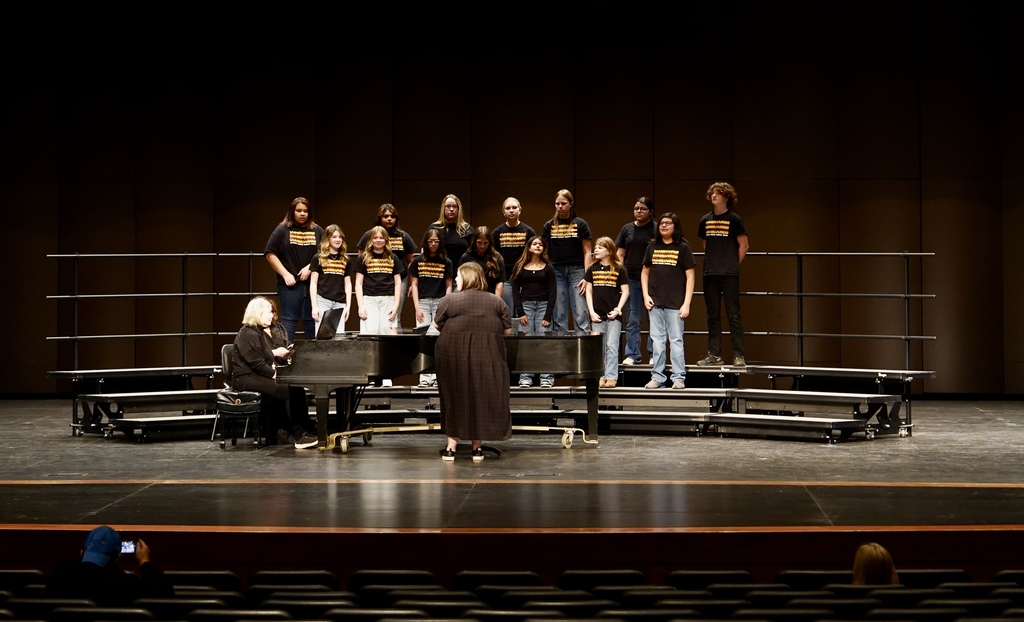 7th grade choir on stage at district choir contest