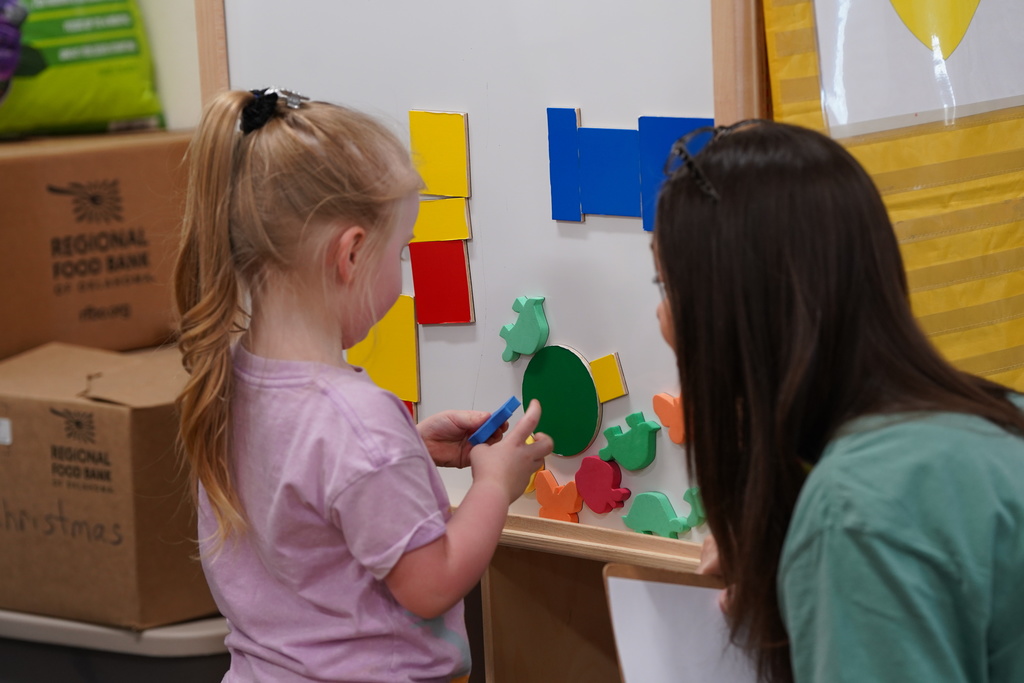 student playing with shapes