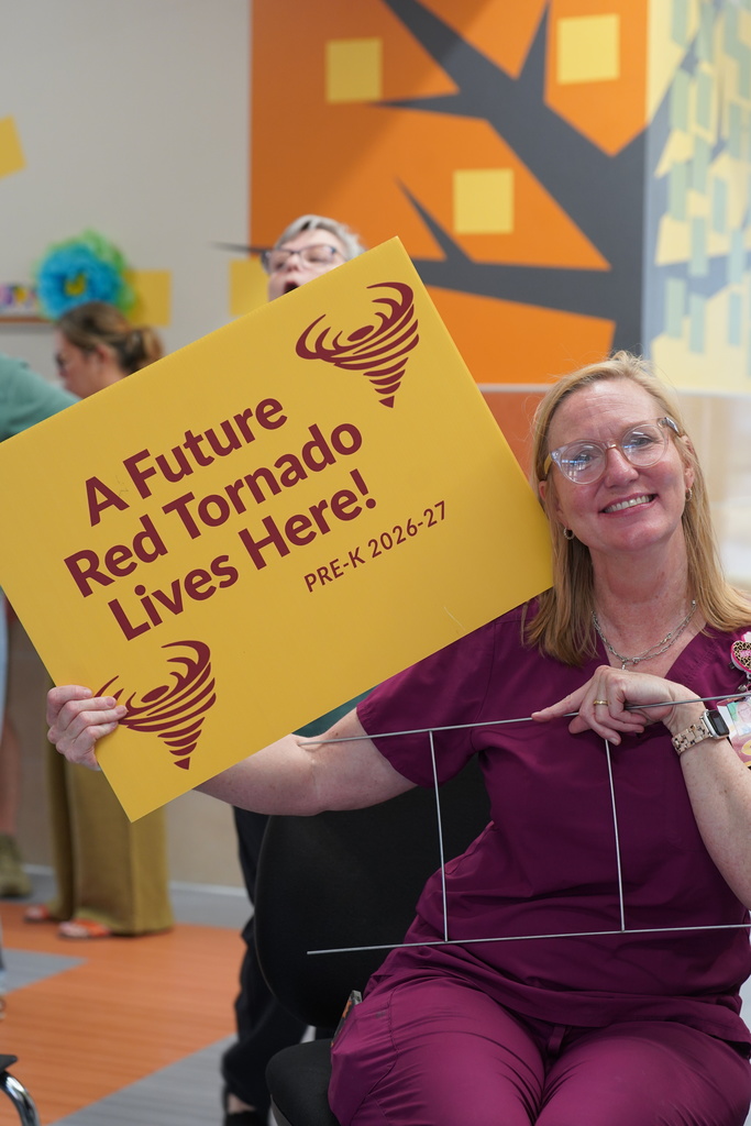Nurse holding a sign