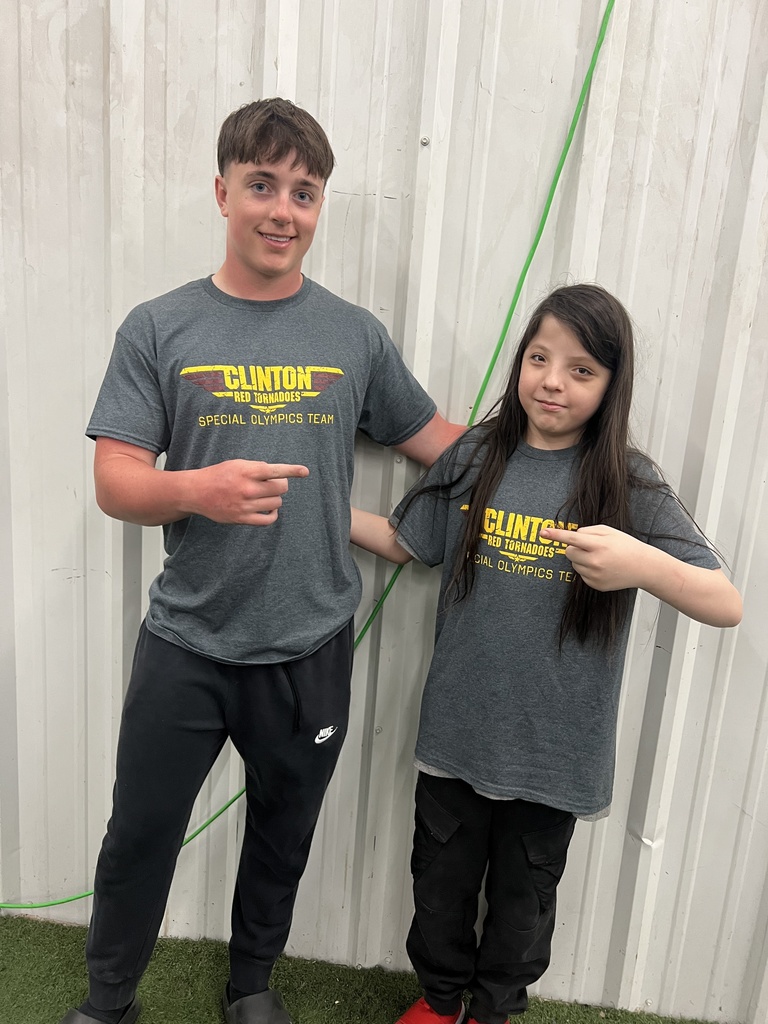 Students smiling and pointing at each other