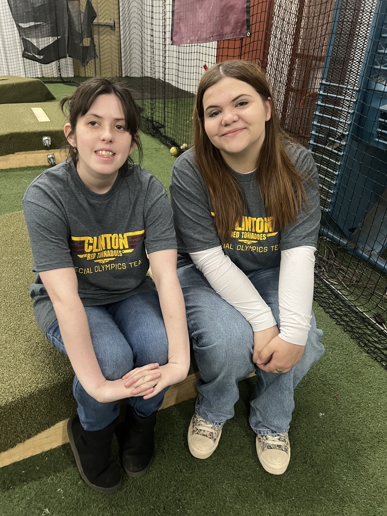 Students sitting and smiling