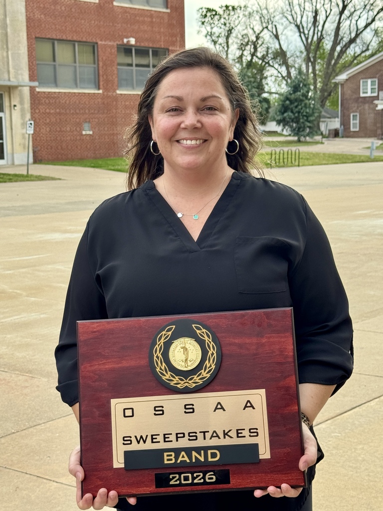 Band Director holding Sweepstakes award