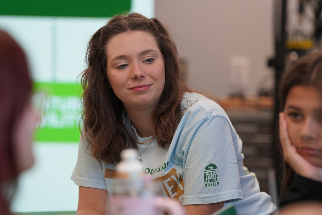 Journey of Hope presenter listening to student conversations