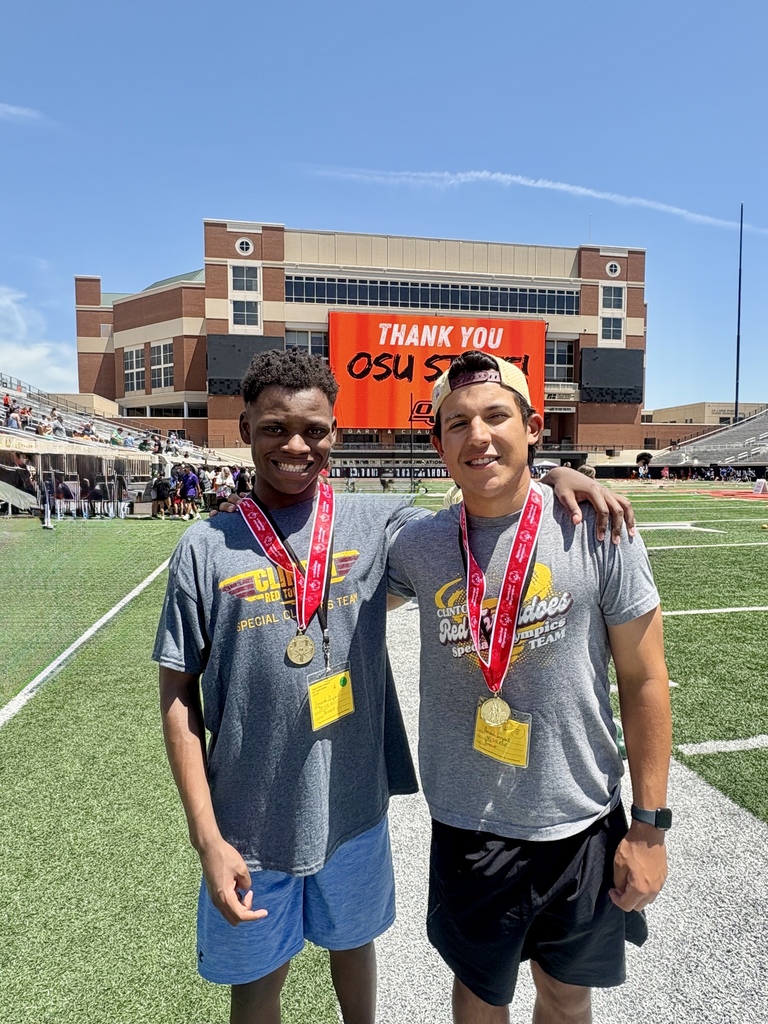 Special Olympics team member with his arm around his team partner