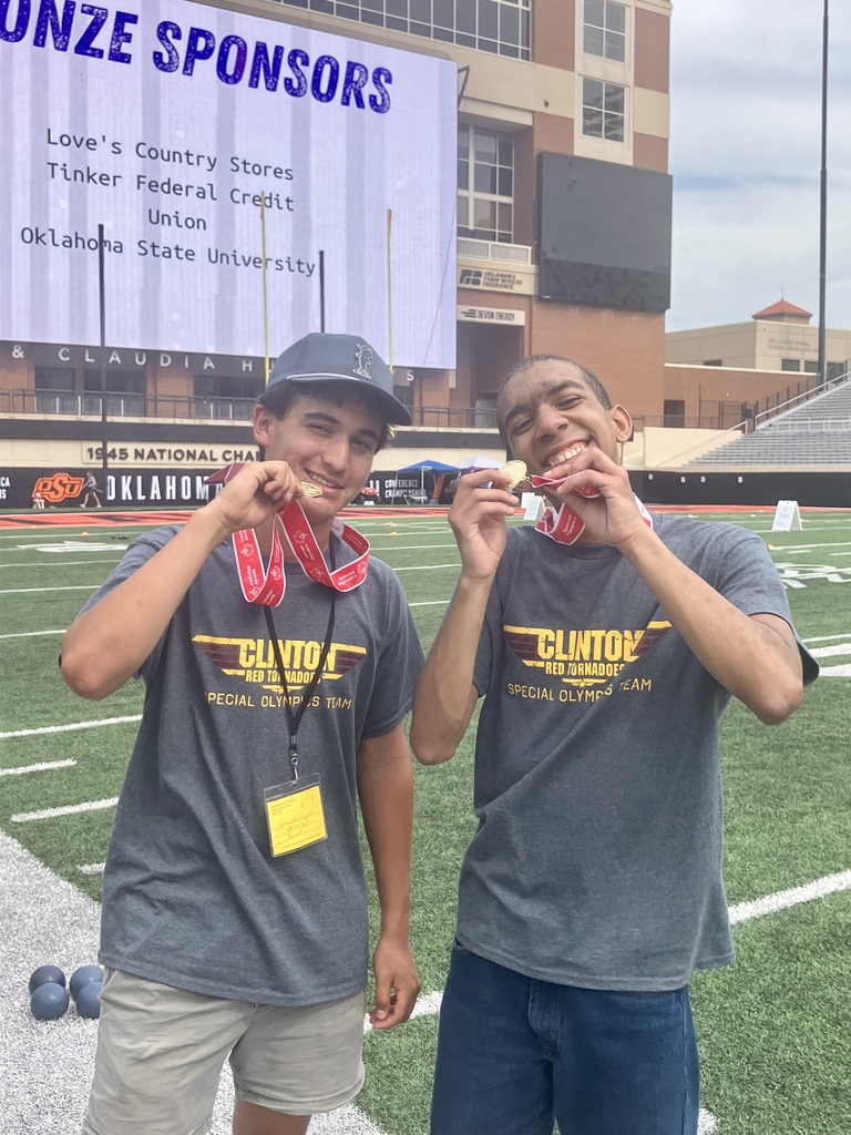 Smiling Special Olympics partners with medals