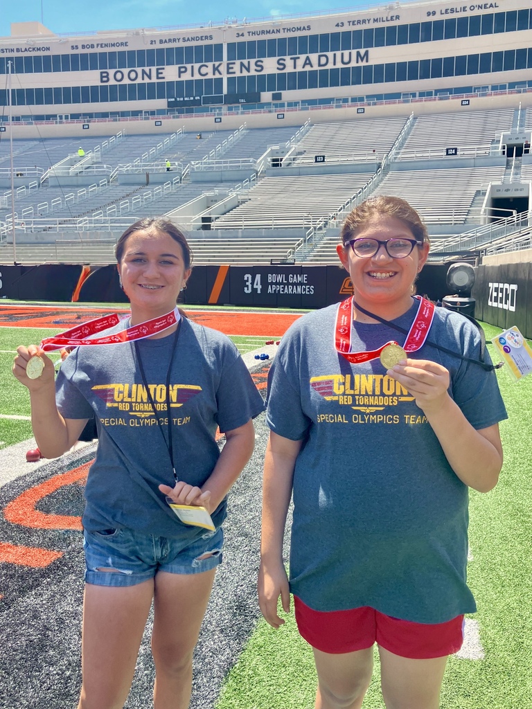 Special Olympics winners showing off their medals