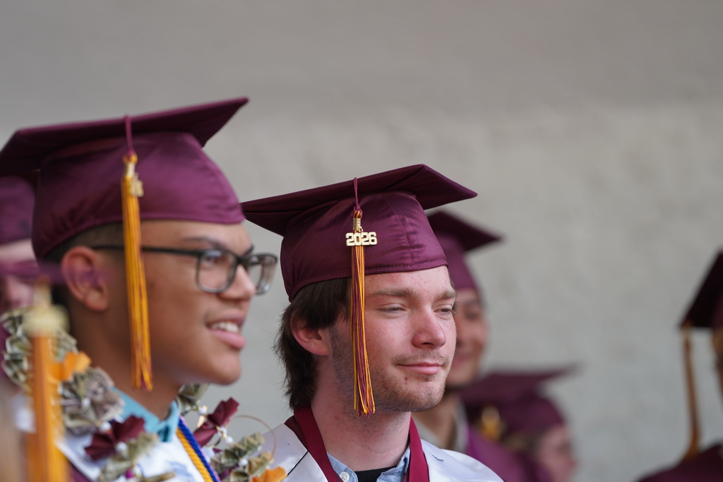 Graduates waiting out the rain
