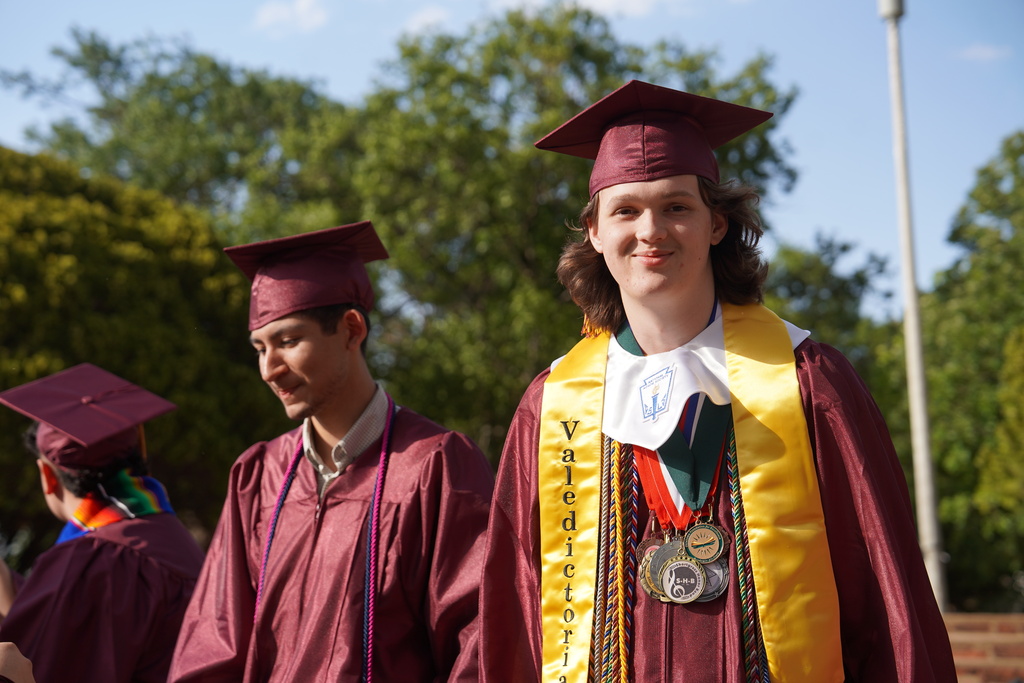CHS Valedictorian smiling at the camera