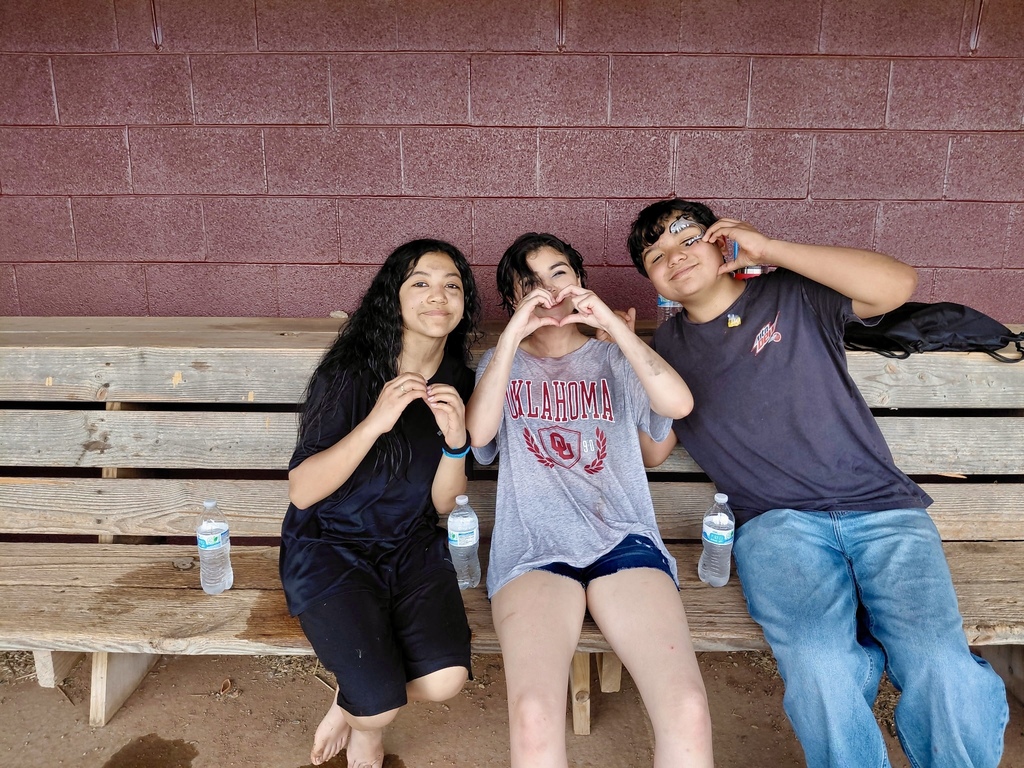 Students with love hand gestures at CMS Champions Party