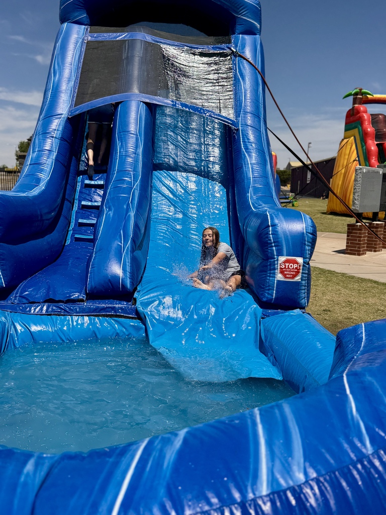 Student on water slide at CMS Champions Party