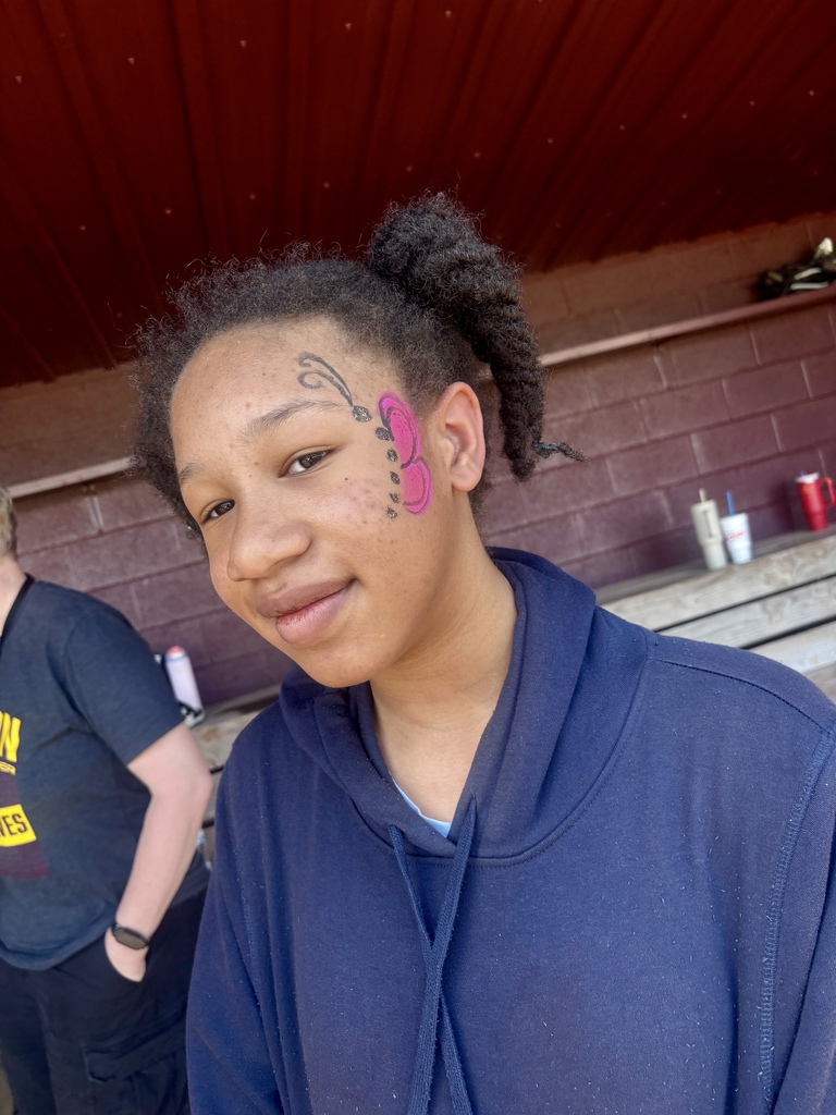 Student with butterfly face paint at CMS Champions Party