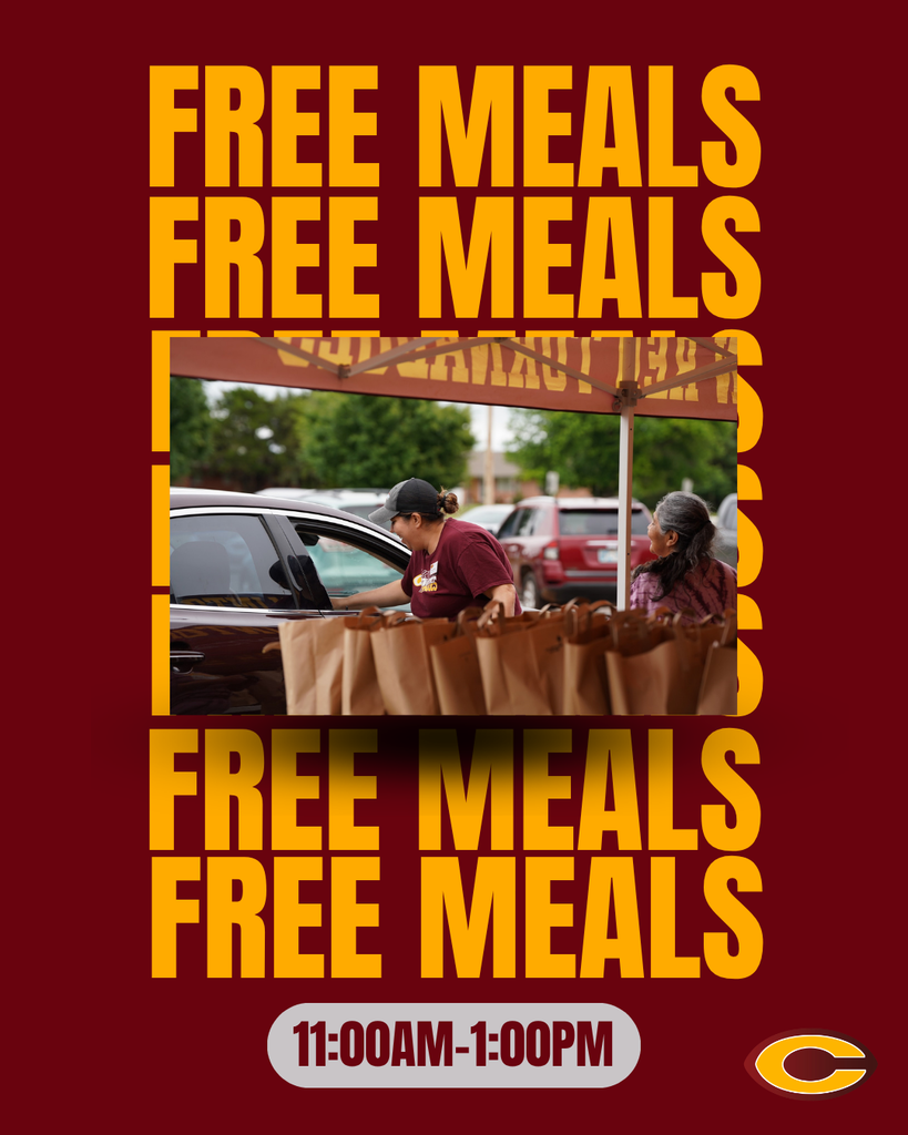 Cafeteria worker handing out free bags of food