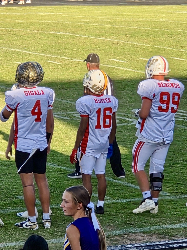 Football players on the sideline of the Classic Bowl