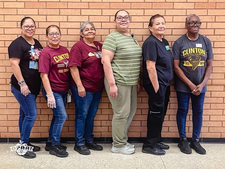6 cafeteria workers standing in front of wall