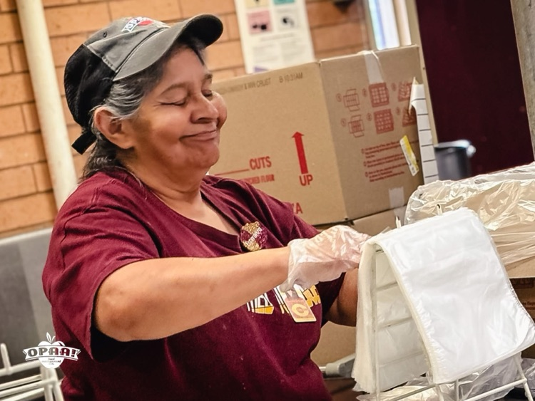 Cafeteria worker packing lunches