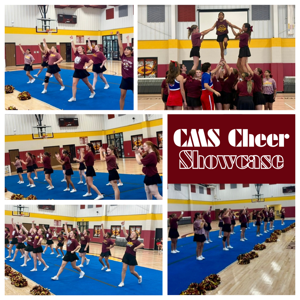 Cheerleaders performing cheers in the gym