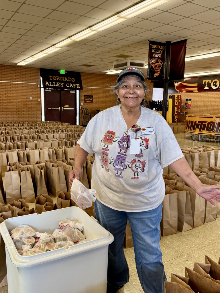 Cafeteria worker packing lunches