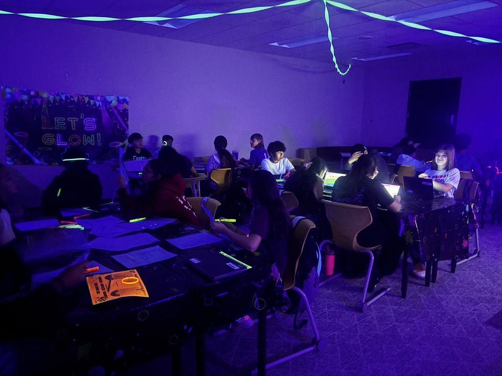 Students in glow classroom