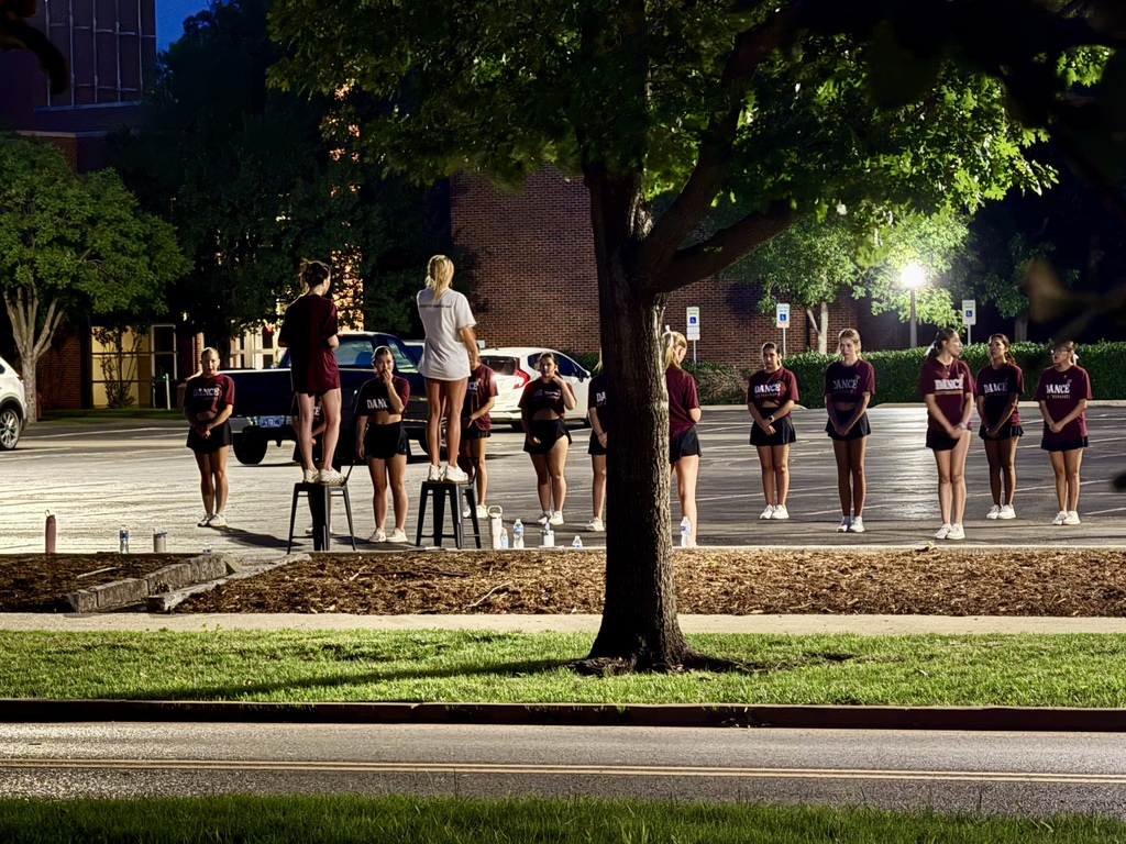 Pom Team outside working on routine