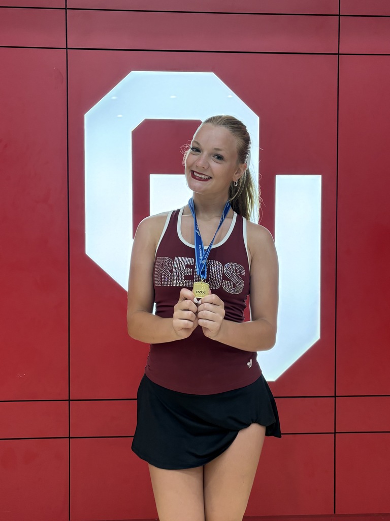 2-Time All-American Pom Dancer holding medal