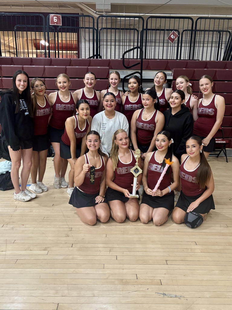 Pom Team holding Superior trophy