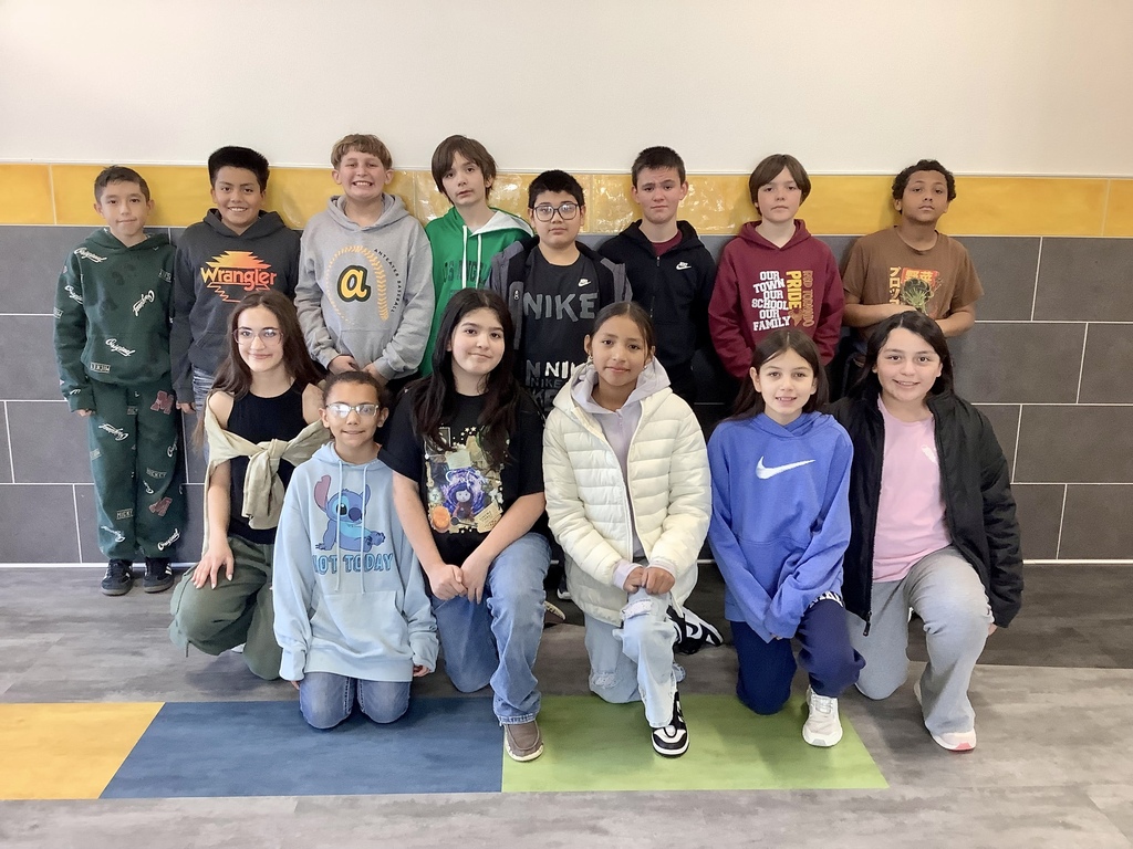 Students in the 5th-grade Math Club standing in the hallway