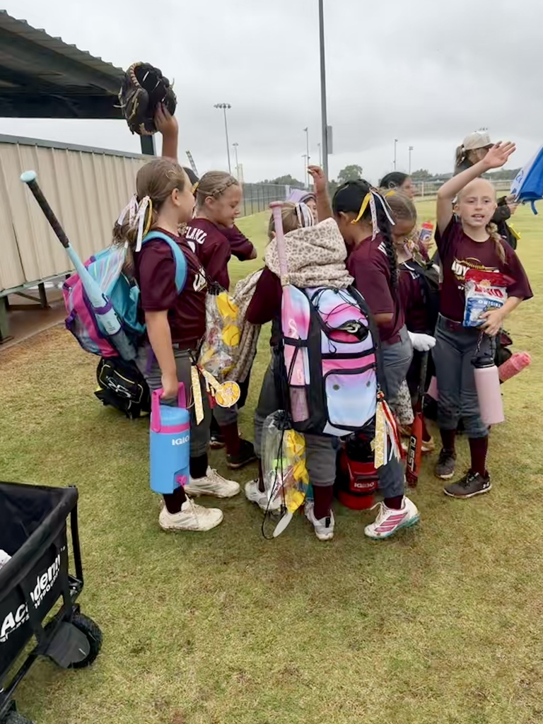 8U Lady Reds celebrating a win