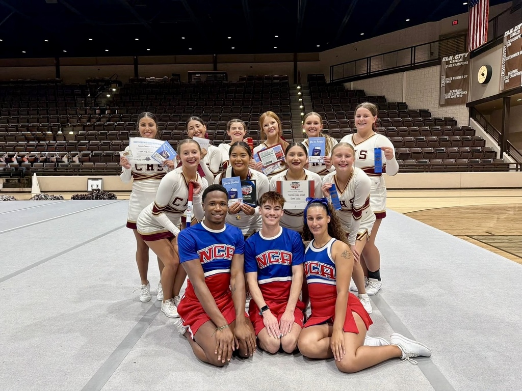CHS Cheer posing with NCA camp leaders