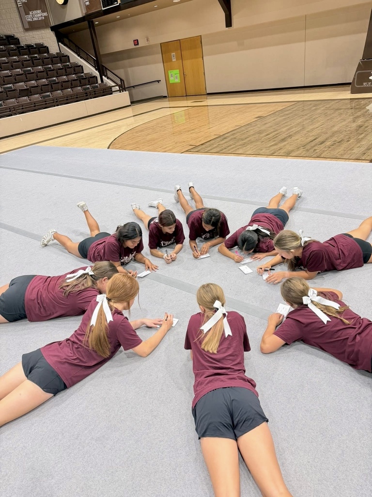 Cheerleaders lying in a circle