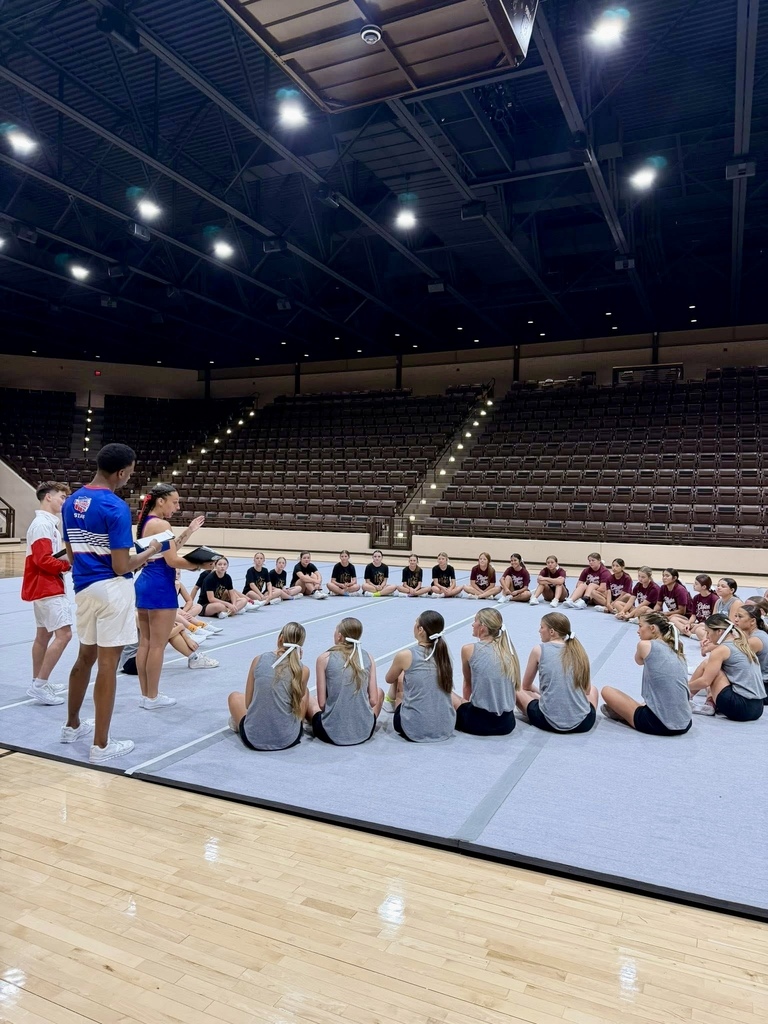 Group of cheerleaders sitting in a circle