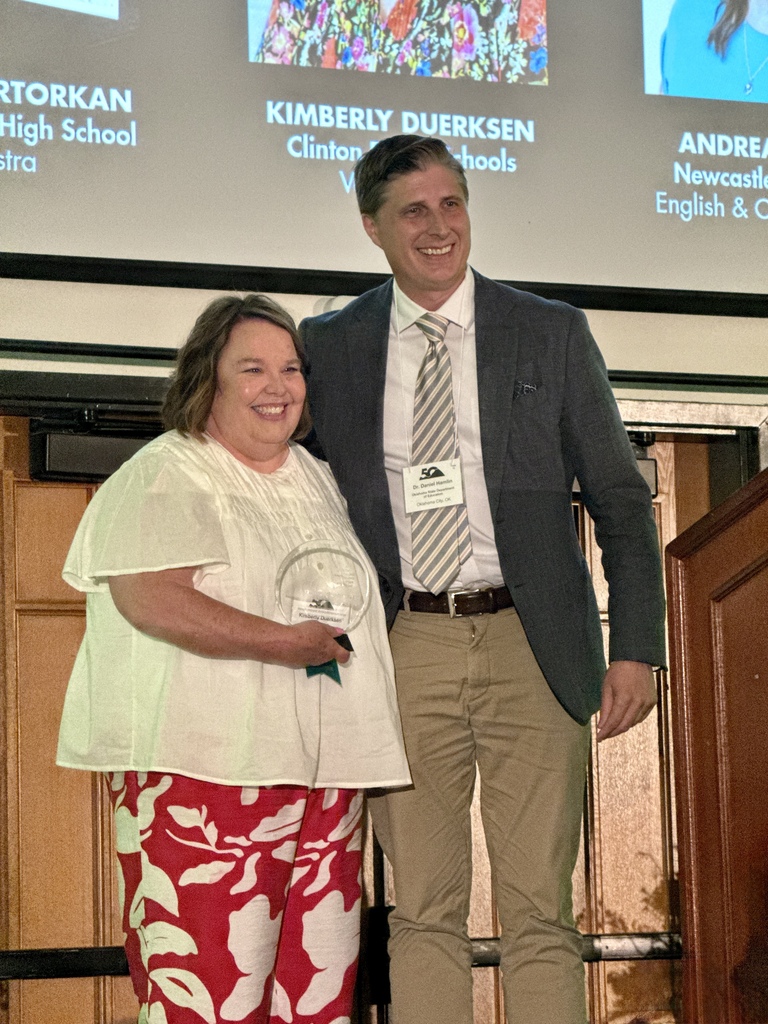 Vocal teacher holding her Transformative Teacher Award
