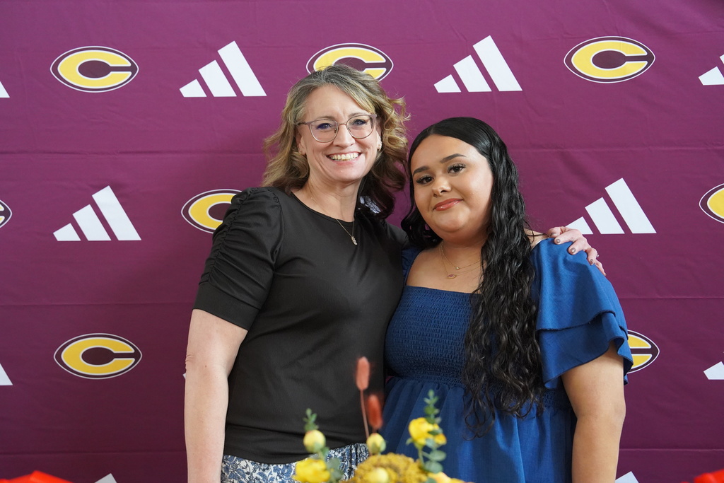 Student and teacher smiling