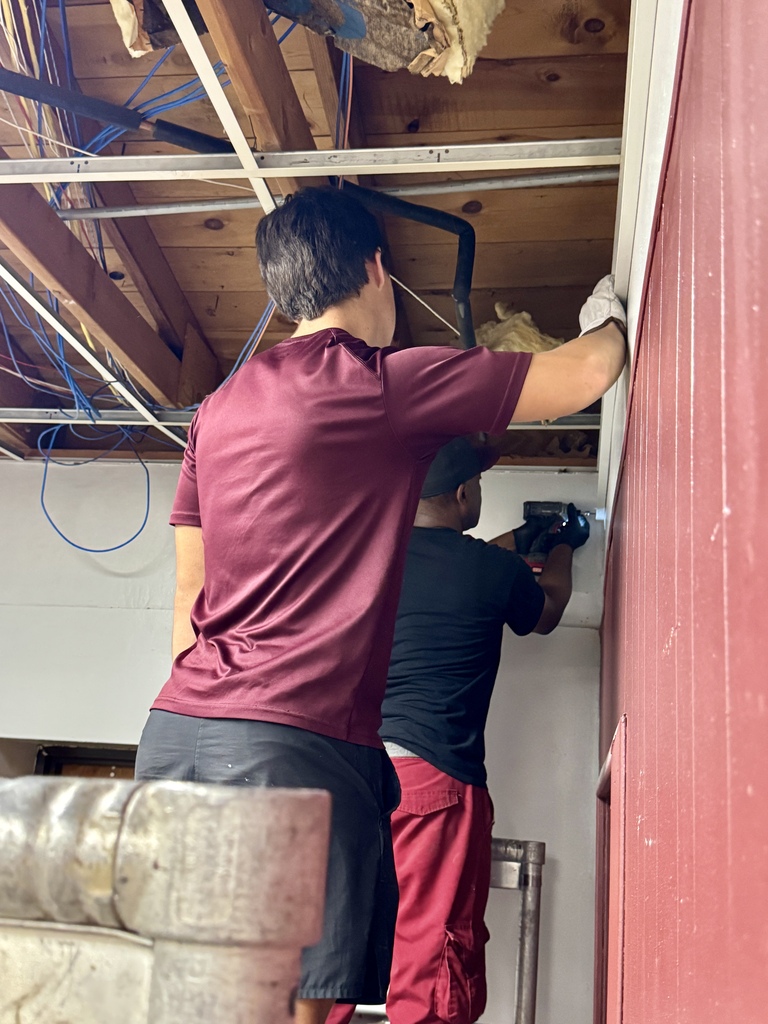 Maintenance crew working on the new resource room at the old CMS