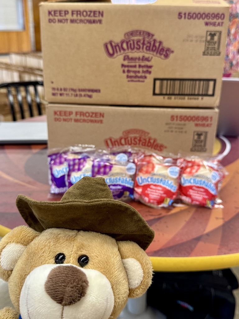 Captain Cafeteria Tex in front of Uncrustables