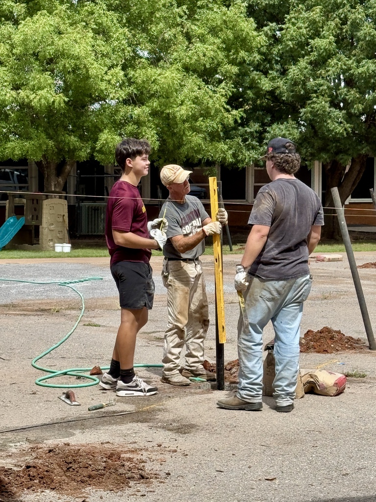 Staff working on daycare fence