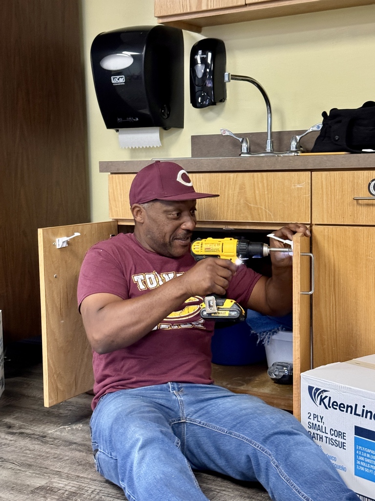 Worker installing chiidproof locks